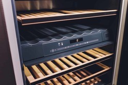 Dual zone wine cooler in a kitchen home rack